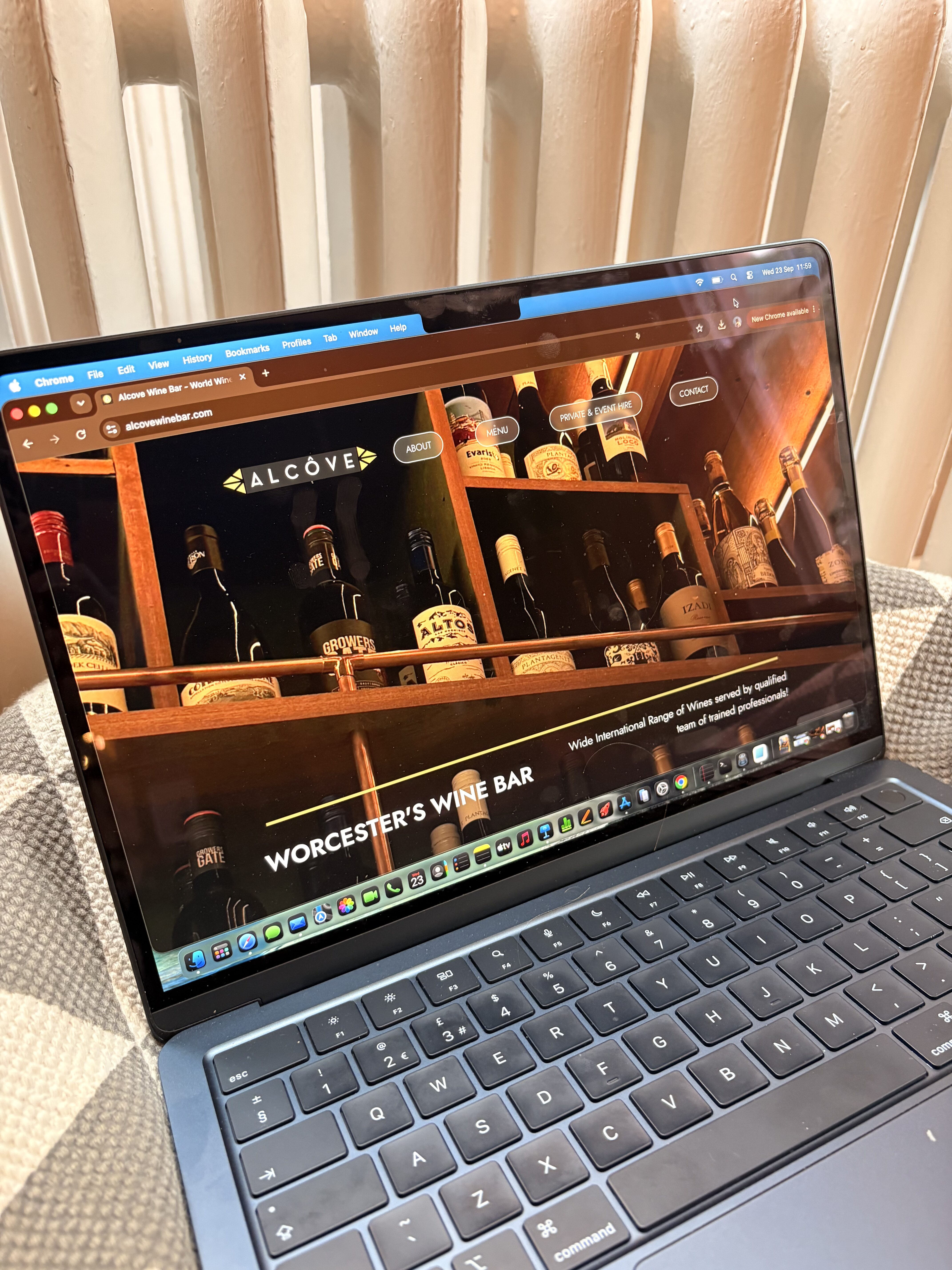 Image showing the Alcove Wine bar homepage on a laptop